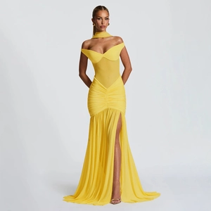 Close-up of bright yellow off-shoulder evening gown with mesh stitching and side split