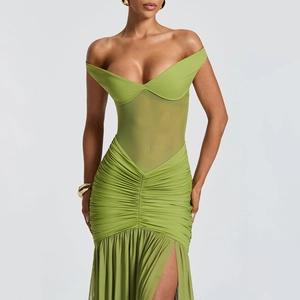 Detail of avocado green mesh dress featuring ruched fabric and high side slit design