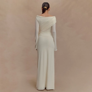 Detailed back view of cream ruched long dress featuring elegant cross-pleats and slim fit