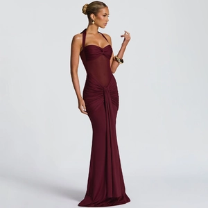 Detailed view of deep burgundy halter dress featuring mesh patchwork and ruching details