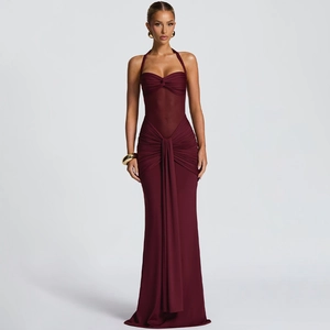 Detailed close-up of the elegant halter neck design and ruched chest detail on the burgundy dress