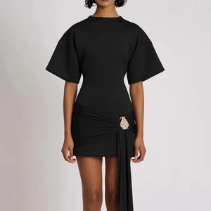 Elegant black slim fit dress featuring pleated drapes and a gold pear-shaped buckle accent