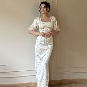 Close-up of vintage square neckline and puff sleeves with delicate lace on floral dress