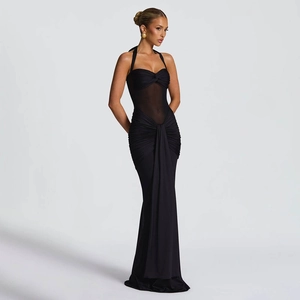 Detail showing the sheer mesh paneling and ruched fabric on this black halter maxi dress