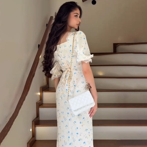 French square neck floral puff sleeve dress with a lace trim and lace-up back design