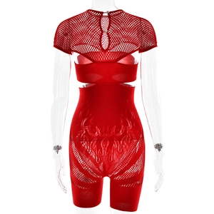 Macro detail of red cutout bodysuit showing flame-pattern mesh and back teardrop openings