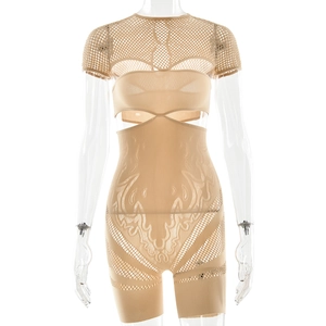 Detail of nude bodysuit featuring mesh panels, hollow design, and firm tummy control texture