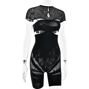 Close-up of black mesh cutout bodysuit with tribal fishnet patterns and hollow design
