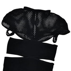 Detail of black mesh patchwork and elastic strap cut-out on sexy slim bodysuit