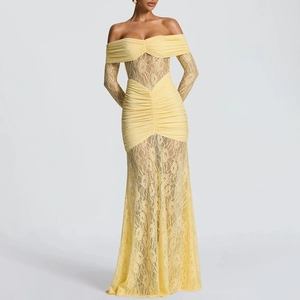 Detailed view of pale yellow lace evening dress featuring ruched bodice and long sleeves