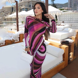 Detail of slim fit long dress featuring abstract purple and brown fluid stripe patterns
