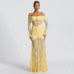 Close-up of yellow lace long sleeves and ruched fabric texture on the elegant maxi dress