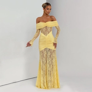 Detail of elegant yellow lace long-sleeved dress with off-shoulder neckline and ruched fabric