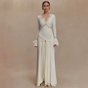Detail of V-neck lace trim and layered ruffle sleeves on creamy maxi evening dress