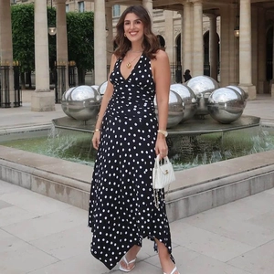 Elegant halter neck V-neck polka dot dress with pleated waist and flowing irregular hemline