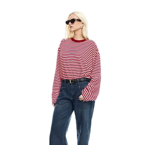 Detailed view of red and white striped long sleeve T-shirt with casual styling