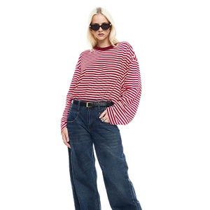 Detail of red and white striped long sleeve shirt with a ribbed crew neck on a model
