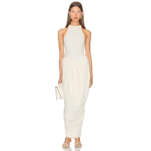 Detail of ruched texture and draped hem on an elegant off-white sleeveless maxi dress