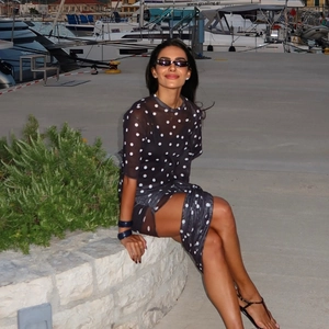 Slim fit black polka dot sheer dress with long sleeves for elegant summer resort style