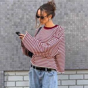 Detail of red and white striped oversized long-sleeved T-shirt with a round neck line