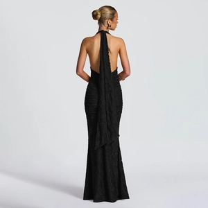Elegant backless halter neck black evening dress with textured lace and long ribbons