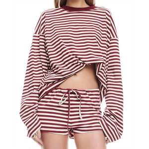 Detail of red and white striped pajama set with textured ribbed fabric and drawstring waist
