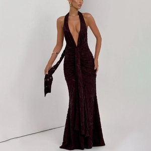 Detail of ruched jacquard texture and deep V-neckline on a burgundy evening fishtail dress