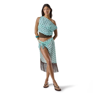 Detail view of the boho beach set featuring blue polka dot fabric and long brown tassels