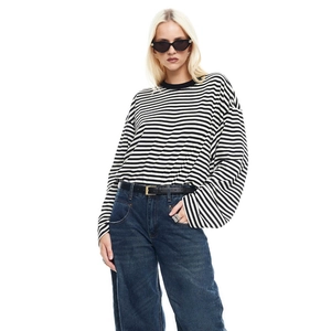 Striped long sleeve T-shirt with high waist denim jeans and black sunglasses
