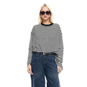Close-up of black and white striped long sleeve shirt with classic round neck and knit fabric