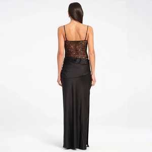 Detailed close-up of intricate black lace back design and glossy satin skirt texture
