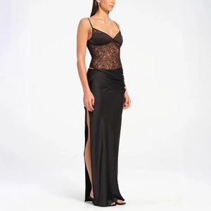 Detail of elegant black satin dress featuring lace bodice and high side slit design