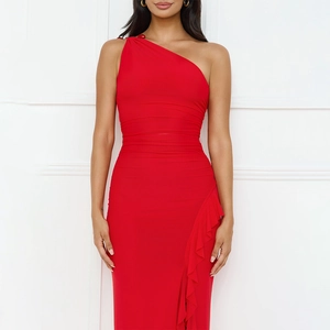 Detail of red one-shoulder evening dress with ruffled slit and elegant side pleats