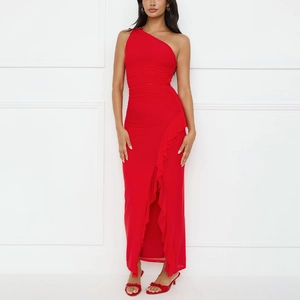 Close-up of red one-shoulder dress featuring pleated waist and side slit ruffle detail