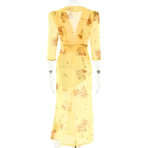 Rear view of a light yellow V-neck floral chiffon midi dress with sheer mesh sleeves