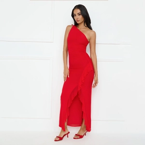 Detail of red one-shoulder dress showing waist ruching and side slit with ruffles