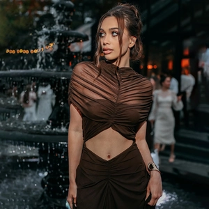 Detail of dark brown ruched bodycon dress with waist cut-out and mesh draping