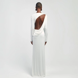 Elegant white backless long sleeve maxi dress with asymmetric cutout and drape details