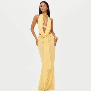 Pale yellow backless halter two-piece set featuring draped neckline and long pleated skirt
