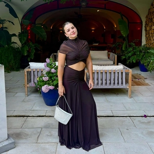 Detail of dark brown two-piece mesh set featuring a ruched cropped top and maxi skirt