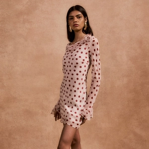 Polka dot long sleeve mini dress with a large 3D rose flower detail on the shoulder