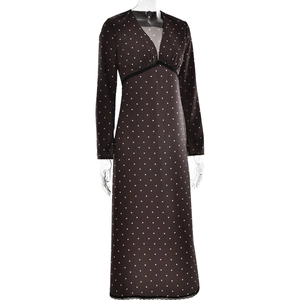 Detail of dark brown polka dot V-neck dress featuring elegant black lace trim accents