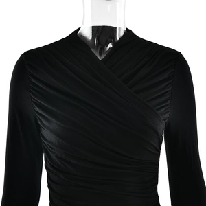 Detail of cross V-neck and ruched pleats on black slim fit long sleeve top