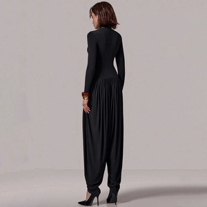 Chic black long sleeve jumpsuit featuring high neck and pleated wide leg harem pants