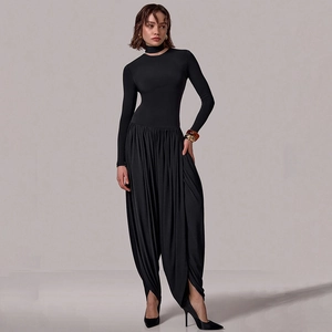 Slim fit black long sleeve jumpsuit with choker neck and side slit draped trousers