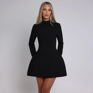 Detail of elegant black long sleeve A-line mini dress with structured waist and neck line
