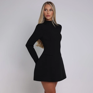 Detail of elegant black long-sleeve mini dress with a slim waist and structured A-line skirt