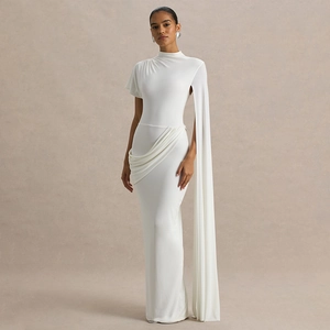 Elegant white asymmetric gown with high neck, ruched detail and long cape sleeve