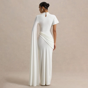 Elegant white slim-fit maxi dress with asymmetric cape sleeve and ruched draping