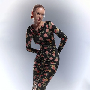 Detail of elegant rose floral print and ruched texture on a slim fit long sleeve dress